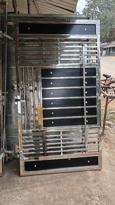 Modern stainless steel gate with horizontal slat design and glass panel accents